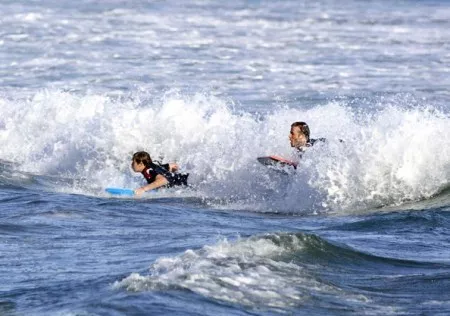 David Beckham and his oldest son, Brooklyn boogie boarding