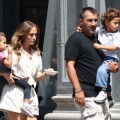 Jennifer Lopez carries her children Max and Emme around the set of her new music