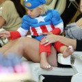 Zuma Rossdale in a Captain America costume as he gets his toes done