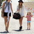 Nicole Richie hits the beach in Malibu, CA on September 3, 2011 with daughter Harlow Madden