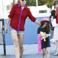 Suri Cruise, age 5, seen wearing a dark shade of lipstick as she and Katie Holmes arrive back at their NYC apartment.