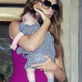 Victoria Beckham holds Harper close as she leaves the Plaza Hotel in New York City after having lunch.