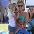 Denise Richards takes her baby daughter Eloise to the park with older daughters Lola and Sam to watch Sam play soccer