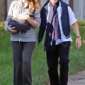 Nicolas and Carla Bruni Sarkozy and their newborn daughter Giulia take a walk in Versailles, France