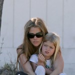 Denise Richards cheers on her daughter Lola during her soccer game while on the sidelines with her other daughter Sam