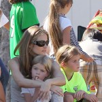 Denise Richards cheers on her daughter Lola during her soccer game while on the sidelines with her other daughter Sam