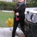Hilary Duff made her way to a Pilates class in Los Angeles, California on October 26, 2011 wearing an all black tight outfit which showed off her growing baby bump.