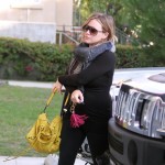 Hilary Duff made her way to a Pilates class in Los Angeles, California on October 26, 2011 wearing an all black tight outfit which showed off her growing baby bump.