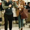 Miranda Kerr and Orlando Bloom with Son Flynn at Heathrow International Airport in London, England (October 12).