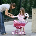 Katie Holmes takes her adorable daughter Suri for a walk as Suri pushes a play stroller for her panda bear stuffed animal in Pittsburgh 10-08-2011 Katie Holmes takes her adorable daughter Suri for a walk as Suri pushes a play stroller for her panda bear stuffed animal in Pittsburgh 10-08-2011