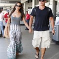 Newlyweds Nick Lachey and Vanessa Minnillo touched down at the LAX airport in Los Angeles, California on July 25, 2011 after their honeymoon in St. Barths. The happy couple smiled as they showed off their tan strolling through the airport to their car.
