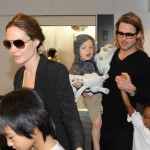 Brad Pitt and Angelina Jolie at the Haneda International Airport in Tokyo with their 6 children (November 10).