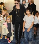 Brad Pitt and Angelina Jolie at the Haneda International Airport in Tokyo with their 6 children (November 10).