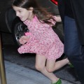 Suri Cruise runs past photographers on her way home as mom, Katie Holmes strides in at a more normal speed on November 7, 2011 in new York City, New York.