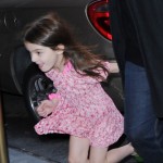 Suri Cruise runs past photographers on her way home as mom, Katie Holmes strides in at a more normal speed on November 7, 2011 in new York City, New York. Suri Cruise runs past photographers on her way home as mom, Katie Holmes strides in at a more normal speed on November 7, 2011 in new York City, New York.