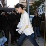Suri Cruise runs past photographers on her way home as mom, Katie Holmes strides in at a more normal speed on November 7, 2011 in new York City, New York. Suri Cruise runs past photographers on her way home as mom, Katie Holmes strides in at a more normal speed on November 7, 2011 in new York City, New York.