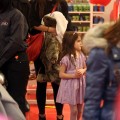 Suri Cruise and Katie Holmes at New York's FAO Schwartz toy store (December 14)