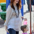 BABY BUMP ALERT! Alyson Hannigan, who is currently pregnant with her second child, takes her daughter Satyana to play at the park with husband Alexis Denisof