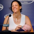 Lindsay Davenport holds her son Jagger Jonathan Leach as she speaks with reporters during a news conference before the Pilot Pen Tennis tournament in New Haven