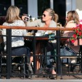 Pregnant actress Molly Sims showing off her sonogram pictures to friends while out for lunch at Cafe Med in West Hollywood, CA on February 19, 2012