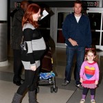 Alyson Hannigan shows off a huge baby bump as she arrives at JFK Airport in New York with husband Alexis Denisof and daughter Satyana. Alyson Hannigan shows off a huge baby bump as she arrives at JFK Airport in New York with husband Alexis Denisof and daughter Satyana.