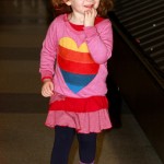 Alyson Hannigan shows off a huge baby bump as she arrives at JFK Airport in New York with husband Alexis Denisof and daughter Satyana. Alyson Hannigan shows off a huge baby bump as she arrives at JFK Airport in New York with husband Alexis Denisof and daughter Satyana.