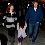 Alyson Hannigan shows off a huge baby bump as she arrives at JFK Airport in New York with husband Alexis Denisof and daughter Satyana. Alyson Hannigan shows off a huge baby bump as she arrives at JFK Airport in New York with husband Alexis Denisof and daughter Satyana.
