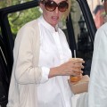 Pregnant actress Uma Thurman arrives at her apartment carrying fresh orange juice