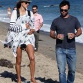 Model Alessandra Ambrosio enjoyed a stroll down the beach in Malibu, California on July 14, 2012 with her newborn son Noah and her long-term fiance Jamie Mazur.