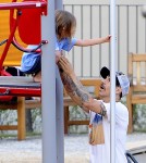 Red Hot Chili Peppers singer Anthony Kiedis spends his free time playing with his son Everly Bear on playground in a park in Prague, Czech Republic on August 26, 2012. Anthony, his girlfriend and Everly chased each other around on the grass.