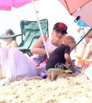 Singer Gwen Stefani and her sons Kingston and Zuma enjoying a day on the beach with friends and family members in Newport Beach, California on August 19, 2012.