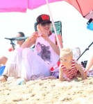 Singer Gwen Stefani and her sons Kingston and Zuma enjoying a day on the beach with friends and family members in Newport Beach, California on August 19, 2012.