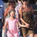 Model Kate Moss and her daughter Lila take a walk on the beach while vacationing in Saint-Tropez, France on August 16, 2012.