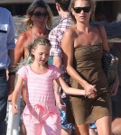 Model Kate Moss and her daughter Lila take a walk on the beach while vacationing in Saint-Tropez, France on August 16, 2012.