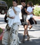 Kim and Kourtney Kardashian arrived at a church in Thousand Oaks, California on August 26, 2012. Kourtney had her children daughter Penelope and son Mason Disick with them for the service. Kim made sure Mason was taken care of while mom Kourtney kept his new baby sister covered on the way into the church.