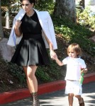 Kim and Kourtney Kardashian arrived at a church in Thousand Oaks, California on August 26, 2012. Kourtney had her children daughter Penelope and son Mason Disick with them for the service. Kim made sure Mason was taken care of while mom Kourtney kept his new baby sister covered on the way into the church.