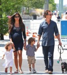 Matthew McConaughey takes the day with his family on the coast in New York, New York on August 26th, 2012. Pregnant wife Camila Alves held onto Vida while Matthew clutched onto Levi.