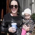 Pink is all smiles as she leaves her hotel carrying daughter Willow and a cup of coffee on September 13, 2012 in London, England.