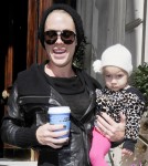 Pink is all smiles as she leaves her hotel carrying daughter Willow and a cup of coffee on September 13, 2012 in London, England.