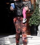 Pink is all smiles as she leaves her hotel carrying daughter Willow and a cup of coffee on September 13, 2012 in London, England.