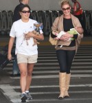 Katherine Heigl, her mom Nancy, husband Josh and new baby Adalaide arriving on a flight at LAX airport in Los Angeles, California on September 6, 2012. The family was met at the airport by her adopted sister Meg Heigl