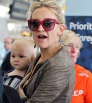 Kate Hudson carries her son Bingham through the airport in Toronto, Canada on September 10, 2012.