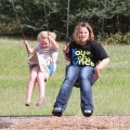Reality TV star Alana Thompson aka 'Honey Boo Boo' wears heels while swinging at the with her sisters Jessica