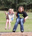 Reality TV star Alana Thompson aka 'Honey Boo Boo' wears heels while swinging at the with her sisters Jessica