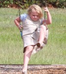 Reality TV star Alana Thompson aka 'Honey Boo Boo' wears heels while swinging at the with her sisters Jessica
