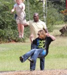 /Reality TV star Alana Thompson aka 'Honey Boo Boo' wears heels while swinging at the with her sisters Jessica