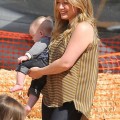 Actress Hilary Duff and husband Mike Comrie take their son Luca to the Mr. Bones Pumpkin Patch in West Hollywood, California on October 13, 2012.