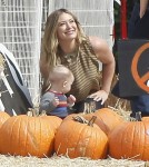 Actress Hilary Duff and husband Mike Comrie take their son Luca to the Mr. Bones Pumpkin Patch in West Hollywood, California on October 13, 2012.