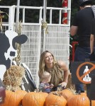 Actress Hilary Duff and husband Mike Comrie take their son Luca to the Mr. Bones Pumpkin Patch in West Hollywood, California on October 13, 2012.