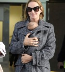 Uma Thurman and Rosalind Luna arrive at Heathrow Airport from Los Angeles on October 17, 2012 in London, England.